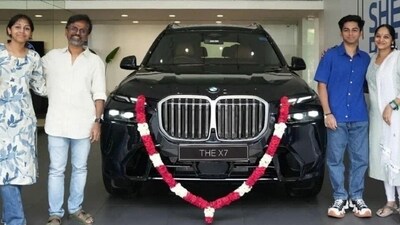 AR Murugadoss and his family all smiles with their new SUV (X) AR Murugadoss and his family all smiles with their new SUV (X)