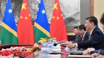 FILE - Chinese President Xi Jinping talks to Prime Minister of the Solomon Islands Manasseh Sogavare, not pictured, during their meeting at the Diaoyutai State Guesthouse in Beijing, Wednesday, Oct. 9, 2019. Beijing is increasingly targeting its South Pacific political allies with its shrinking aid budget as competition intensifies with the United States for influence in the region, Sydney’s Lowy Institute has reported in its latest annual analysis of regional assistance.(Parker Song/Pool Photo via AP, File) (AP) FILE - Chinese President Xi Jinping talks to Prime Minister of the Solomon Islands Manasseh Sogavare, not pictured, during their meeting at the Diaoyutai State Guesthouse in Beijing, Wednesday, Oct. 9, 2019. Beijing is increasingly targeting its South Pacific political allies with its shrinking aid budget as competition intensifies with the United States for influence in the region, Sydney’s Lowy Institute has reported in its latest annual analysis of regional assistance.(Parker Song/Pool Photo via AP, File) (AP)