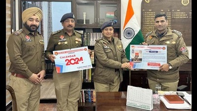 Commissioner of Police Kuldeep Chahal releasing calendar on cyber security in Ludhiana. (HT)