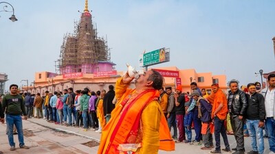 Devotees wait in a queue to visit the Shri Ram Janmabhoomi Temple, in Ayodhya, (PTI)