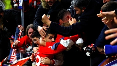 Atletico Madrid's Alvaro Morata celebrates scoring their second goal with fans (REUTERS)