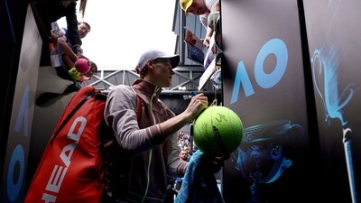 Italy's Jannik Sinner gives autographs to fans after victory against Argentina's Sebastian Baez during their men's singles match on day six of the Australian Open tennis tournament in Melbourne on January 19 (AFP) Italy's Jannik Sinner gives autographs to fans after victory against Argentina's Sebastian Baez during their men's singles match on day six of the Australian Open tennis tournament in Melbourne on January 19 (AFP)