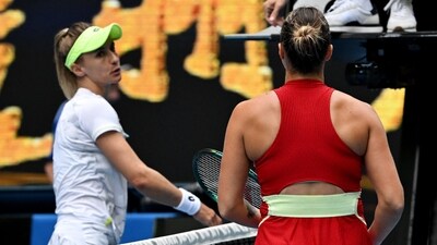 Ukraine's Lesia Tsurenko shakes hands with the umpire after losing her third round match as Belarus' Aryna Sabalenka looks on (REUTERS)