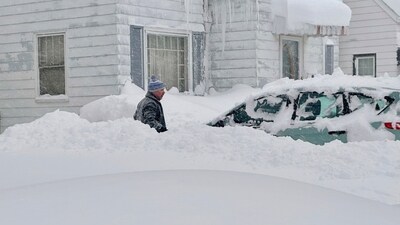 Travel bans were issued for several suburbs. The winter blast comes days after a storm that delayed an NFL playoff game for a day. (AP Photo/Carolyn Thompson) (AP) Travel bans were issued for several suburbs. The winter blast comes days after a storm that delayed an NFL playoff game for a day. (AP Photo/Carolyn Thompson) (AP)