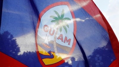 Local residents display a Guam flag during a peace rally at Chief Quipuha Park, on the island of Guam, a U.S. Pacific Territory, August 14. (REUTERS) Local residents display a Guam flag during a peace rally at Chief Quipuha Park, on the island of Guam, a U.S. Pacific Territory, August 14. (REUTERS)