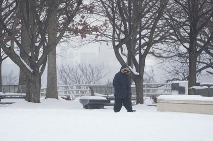 A person walks through snow Thursday, Jan. 18, 2024, in Nashville, Tenn. A snowstorm blanketed the area with up to eight inches of snow and frigid temperatures. (AP Photo/George Walker IV) (AP) A person walks through snow Thursday, Jan. 18, 2024, in Nashville, Tenn. A snowstorm blanketed the area with up to eight inches of snow and frigid temperatures. (AP Photo/George Walker IV) (AP)