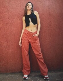 Ananya Panday in a rust-hued contrast stitch cargo pants and a bejewelled crop top (Photo; Instagram)