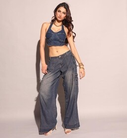 Palak Tiwari in a halter neck top with contrast stitch details and flared washed out pants (Photo: Instagram)