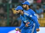 Rohit Sharma and his teammate Virat Kohli (L) look on during the third and final Twenty20 international cricket match between India and Afghanistan
