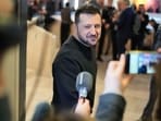 Ukrainian President Volodymyr Zelensky talks to reporters.