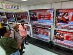 FILE: People watch the Union Budget being presented by Finance Minister Nirmala Sitharaman in the Parliament. (HT PHOTO) FILE: People watch the Union Budget being presented by Finance Minister Nirmala Sitharaman in the Parliament. (HT PHOTO)