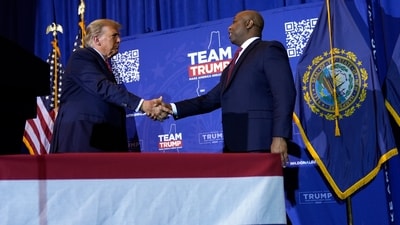 Republican presidential candidate former President Donald Trump shakes hands with Sen. Tim Scott, R-S.C., at a campaign event in Concord, N.H., Friday, Jan. 19, 2024. (AP Photo/Matt Rourke) (AP)