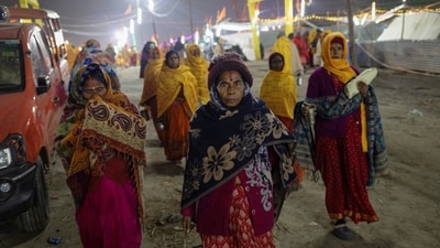 Hindu devotees arrives at the tent city built for the pilgrims on the banks of the Sarayu river ahead of the opening of the grand temple of Lord Ram in Ayodhya. (REUTERS)