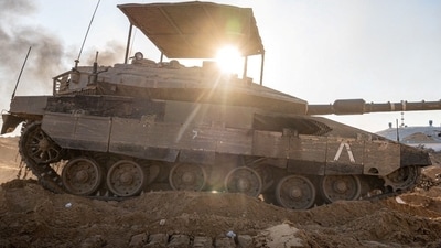 Israeli soldiers operate a tank in the Gaza Strip, amid the ongoing conflict between Israel and the Palestinian Islamist group Hamas. (Reuters)