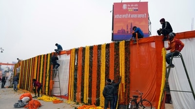 Workers put up decorations by a roadside, two days before the grand opening of a temple dedicated to Lord Ram in Ayodhya. (AP) Workers put up decorations by a roadside, two days before the grand opening of a temple dedicated to Lord Ram in Ayodhya. (AP)
