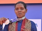 Shyamali Singh with her medal at the Mumbai Marathon 2024