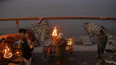 A priest performs ‘Aarti’ at Saryu river Ghat on the eve of the 'Pran Pratishtha' ceremony of Ram Temple in Ayodhya. (ANI) A priest performs ‘Aarti’ at Saryu river Ghat on the eve of the 'Pran Pratishtha' ceremony of Ram Temple in Ayodhya. (ANI)