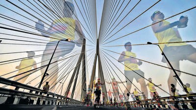 Mumbai, India - Jan. 6, 2020: Participants run on Bandra-Worli sea link bridge as they take part in a marathon in Mumbai, India, on Monday, January 6, 2020. (Photo by Satish Bate/ Hindustan Times) (Hindustan Times) Mumbai, India - Jan. 6, 2020: Participants run on Bandra-Worli sea link bridge as they take part in a marathon in Mumbai, India, on Monday, January 6, 2020. (Photo by Satish Bate/ Hindustan Times) (Hindustan Times)