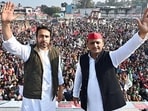 Samajwadi Party (SP) chief Akhilesh Yadav and Rashtriya Lok Dal (RLD) president Jayant Chaudhary during the joint election campaign, in Bijnor on Thursday. (ANI Photo)