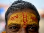 A devotee with his forehead marked with the name of Lord Ram looks on in Ayodhya on January 21, on the eve of the consecration ceremony of Ram temple. A devotee with his forehead marked with the name of Lord Ram looks on in Ayodhya on January 21, on the eve of the consecration ceremony of Ram temple.
