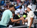 Poland's Hubert Hurkacz (L) shakes hands with France's Arthur Cazaux after the end of their men's singles match on day nine of the Australian Open tennis tournament in Melbourne on January 22 Poland's Hubert Hurkacz (L) shakes hands with France's Arthur Cazaux after the end of their men's singles match on day nine of the Australian Open tennis tournament in Melbourne on January 22