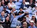 A pro-Palestinian protester throws leaflets onto the court during the men's singles match between Britain's Cameron Norrie and Germany's Alexander Zverev at the Australian Open A pro-Palestinian protester throws leaflets onto the court during the men's singles match between Britain's Cameron Norrie and Germany's Alexander Zverev at the Australian Open