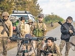 TOPSHOT - This photo taken on December 11, 2023 shows members of the Mandalay People’s Defense Forces (MDY-PDF) preparing to release a drone near the frontline amid clashes with Myanmar's military in northern Shan State. A squad of Myanmar pro-democracy fighters works quickly to ready drones for an attack on a nearby military base, the latest target in a wave of aerial assaults that has helped turn the war against the junta. (Photo by AFP) / TO GO WITH Myanmar-coup, FOCUS (AFP)