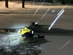 United States: Firefighter braving the cold water to rescue the deer trapped in a pond. United States: Firefighter braving the cold water to rescue the deer trapped in a pond.