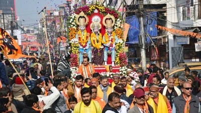 Devotees take part in a procession on the eve of the consecration ceremony of the Ram temple in Ayodhya, in Prayagraj. (ANI) Devotees take part in a procession on the eve of the consecration ceremony of the Ram temple in Ayodhya, in Prayagraj. (ANI)