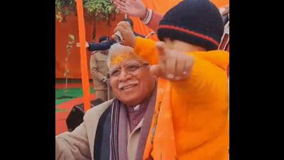 Haryana chief minister Manohar Lal Khattar dancing with a child in Karnal on Monday after watching the Pran Pratishtha ceremony at Ram Temple in Ayodhya. (HT Photo)