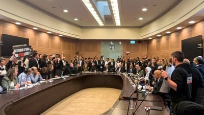 Relatives of Israelis who have been held hostage by Hamas militants since October 7, storm a parliamentary committee session in Jerusalem on January 22. (Reuters)