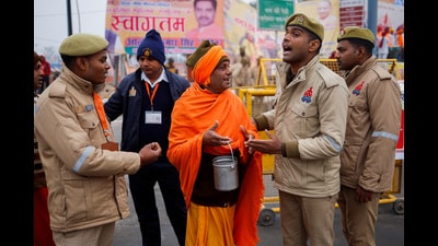 Police officers ask a man to leave the area of the Hindu Lord Ram temple before its inauguration in Ayodhya (REUTERS)