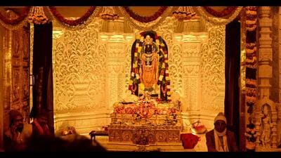 Priests sit near the Ram Lalla idol in Ayodhya on Monday. (AFP) Priests sit near the Ram Lalla idol in Ayodhya on Monday. (AFP)