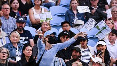 A pro-Palestinian protester throws leaflets onto the court during the men's singles match between Britain's Cameron Norrie and Germany's Alexander Zverev at the Australian Open (AFP)