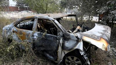 The gutted remains of the Toyota Corolla Altis in which the 30-year-old man was travelling when it rammed the U-turn divider near Sector 59 metro station in Noida on Monday. (Sunil Ghosh/HT Photo) The gutted remains of the Toyota Corolla Altis in which the 30-year-old man was travelling when it rammed the U-turn divider near Sector 59 metro station in Noida on Monday. (Sunil Ghosh/HT Photo)