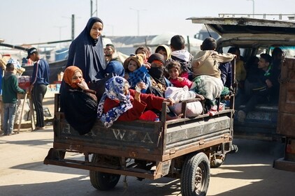 Palestinians fleeing Khan Younis, due to the Israeli ground operation, amid the ongoing conflict between Israel and the Palestinian Islamist group Hamas, arrive in Rafah in the southern Gaza Strip on January 22. (Reuters)