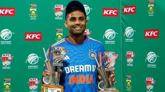 India's Suryakumar Yadav holds the player of the match and player of the series trophies (AFP)