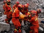 China Landslide: Rescue workers carry a corpse found in the area of a landslide in Liangshui village in Zhaotong, in southwestern China's Yunnan province. China Landslide: Rescue workers carry a corpse found in the area of a landslide in Liangshui village in Zhaotong, in southwestern China's Yunnan province.