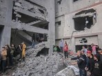 Palestinians amongst the rubble of buildings hit by an Israeli airstrike in Khan Younis, southern Gaza. (Bloomberg) Palestinians amongst the rubble of buildings hit by an Israeli airstrike in Khan Younis, southern Gaza. (Bloomberg)
