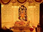 Priests sit near the Ram Lalla idol in Ayodhya on Monday. (AFP) Priests sit near the Ram Lalla idol in Ayodhya on Monday. (AFP)