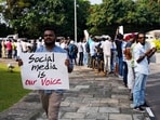 Sri Lankan social media activists hold placards with slogans against the proposed Online Safety Bill during a protest near the Parliament in Colombo, Sri Lanka.