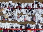 TOPSHOT - This aerial view shows immigrants waiting to be processed at a US Border Patrol transit center after they crossed the border from Mexico in Eagle Pass, Texas, on December 22, 2023. The Republican governor of Texas signed a bill on December 18, 2023 that would allow state police to arrest and deport migrants who cross illegally into the United States from Mexico. (Photo by CHANDAN KHANNA / AFP)