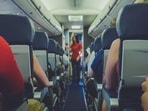 The woman realised that she was on the same flight as her boss after she landed. The woman realised that she was on the same flight as her boss after she landed.