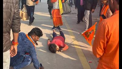 A youth rubbed his face into the ground each time while pulling his body forward on way to the Ram Mandir, a ritual he started from Hanuman Garhi, some 1.5 km away. (Manish Chandra Pandey/HT Photo) A youth rubbed his face into the ground each time while pulling his body forward on way to the Ram Mandir, a ritual he started from Hanuman Garhi, some 1.5 km away. (Manish Chandra Pandey/HT Photo)