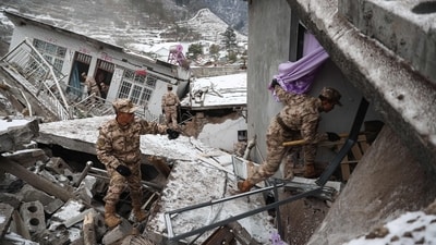 Chinese military police and rescue workers searching for missing victims at a landslide site in Liangshui village in Zhaotong, in southwestern China's Yunnan province. (AFP) Chinese military police and rescue workers searching for missing victims at a landslide site in Liangshui village in Zhaotong, in southwestern China's Yunnan province. (AFP)