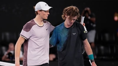Jannik Sinner, left, of Italy is congratulated by Andrey Rublev of Russia following their quarterfinal match at the Australian Open (AP)