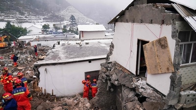 Rescue workers search for missing victims at a damaged house following a landslide in Liangshui village at Zhaotong, in southwestern China's Yunnan province. (AFP) Rescue workers search for missing victims at a damaged house following a landslide in Liangshui village at Zhaotong, in southwestern China's Yunnan province. (AFP)