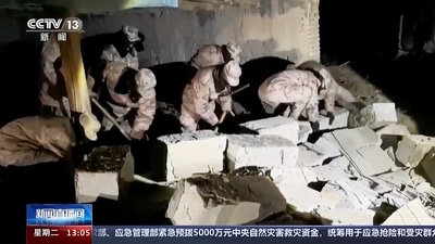 In this image taken from video footage run by China's CCTV, soldiers can be seen clearing rocks caused by the earthquake in Aksu prefecture, China’s Xinjiang on Tuesday. (AP) In this image taken from video footage run by China's CCTV, soldiers can be seen clearing rocks caused by the earthquake in Aksu prefecture, China’s Xinjiang on Tuesday. (AP)