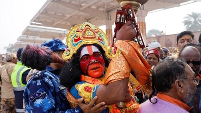 A Hindu devotee waits to enter the Lord Ram temple after its inauguration in Ayodhya on January 23. (REUTERS)