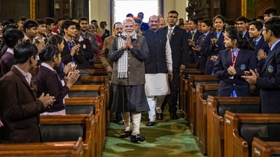 Students greet PM Modi as he arrives to pay tribute to Netaji Subhas Chandra Bose on his birth anniversary, at the Central Hall of Samvidhan Sadan. (PTI) Students greet PM Modi as he arrives to pay tribute to Netaji Subhas Chandra Bose on his birth anniversary, at the Central Hall of Samvidhan Sadan. (PTI)